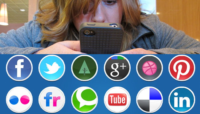 frazzled woman staring in desperation at a mobile phone surrounded by social media icons