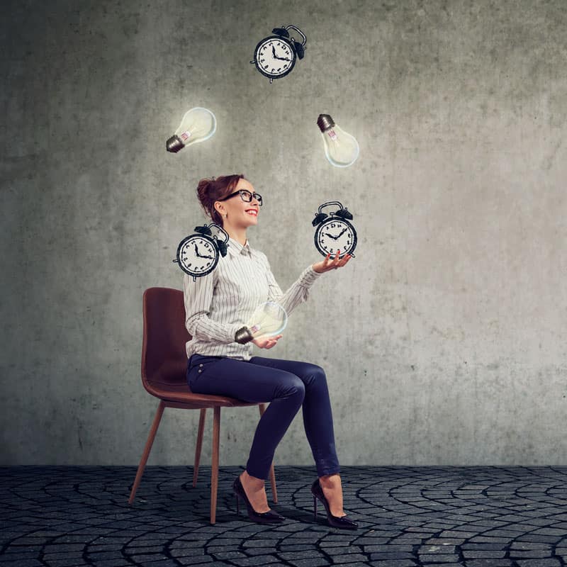 business woman juggling ideas versus time to demonstrate perceived value